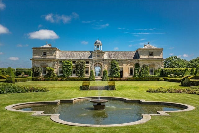 This eight bedroom and nine bathroom detached house is for sale with Savills for £8,000,000