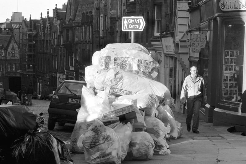 Plastic bags full of rubbish piled up on the pavement in Cockburn Street Edinburgh during the bin men's strike in November 1987.