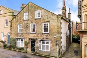 The Grade ll Listed Old Parsonage is a two-bedroom, ground floor apartment with established gardens that have Yorkshire stone patios, and a summer house.