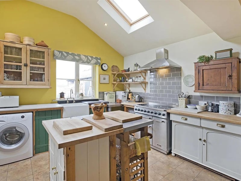 A country style kitchen with central island feature.
