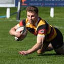 Kristan Dobson scores his second try of the game during Harrogate RUFC's title-clinching victory over Driffield. Pictures: Gerard Binks