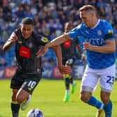Harrogate Town winger Josh Coley takes on Stockport County's Chris Hussey during Saturday's League Two stalemate at Edgeley Park. Picture: Matt Kirkham
