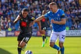 Harrogate Town winger Josh Coley takes on Stockport County's Chris Hussey during Saturday's League Two stalemate at Edgeley Park. Picture: Matt Kirkham