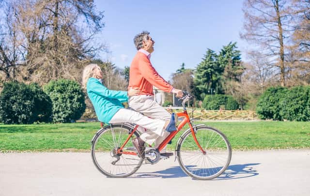 Youthful senior couple riding on a bicycle in a park. These figures show the parts of Sheffield with the highest life expectancy for men