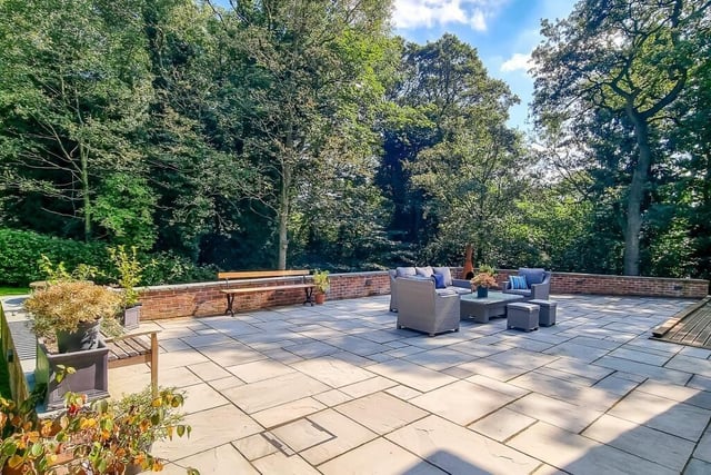 This wide stone-paved terrace provides plenty of entertaining space.