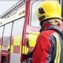 Firefighters from four fire stations were called to a Harrogate district village yesterday to deal with a fire in a barn
