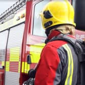 Firefighters from four fire stations were called to a Harrogate district village yesterday to deal with a fire in a barn