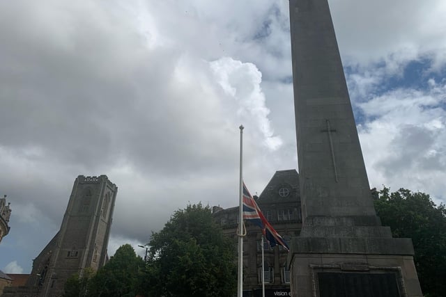 The Union Jack flies at half-mast alongside the cenotaph in Harrogate town centre.