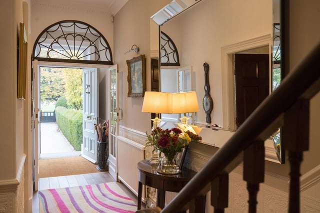 A welcoming porch and hallway leads in to the townhouse.