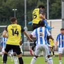Anthony O'Connor climbs highest to head home Harrogate Town's winning goal in Saturday's pre-season friendly win over Huddersfield Town 'B'. Pictures: Matt Kirkham