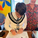 Mayor Mulhall signing the Declaration of Acceptance of Office.