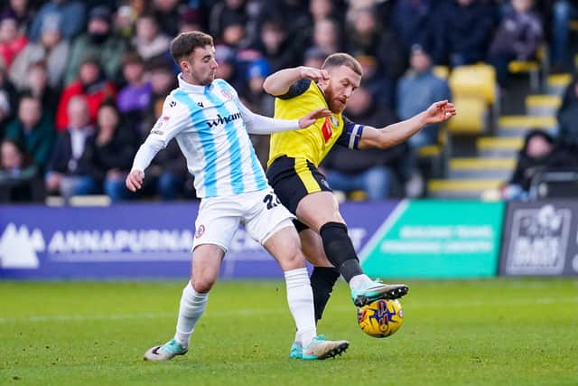 George Thomson competes for possession during Harrogate Town's home win over Accrington Stanley.