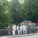 Protest over sewage discharges in the River Nidd - Extinction Rebellion Harrogate activists dressed in white overalls at the High Bridge in Knaresborough on Saturday. (Picture contributed)