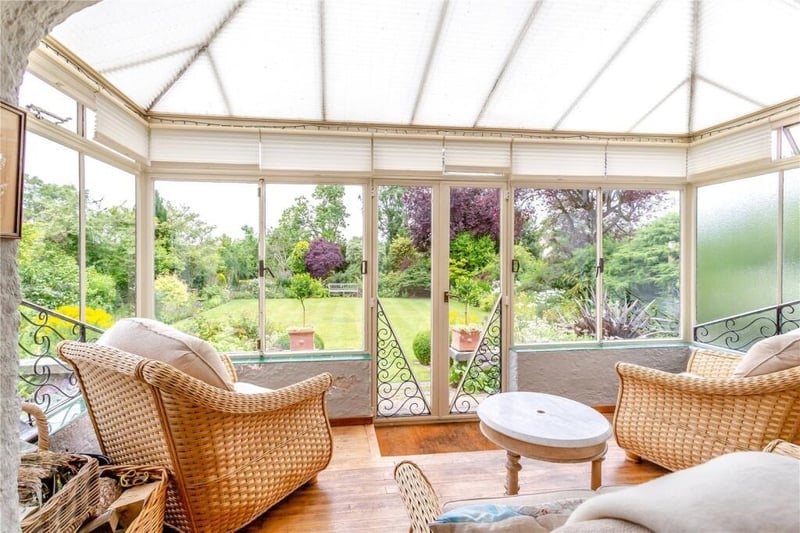 The garden room has French doors out to the well-stocked rear garden.