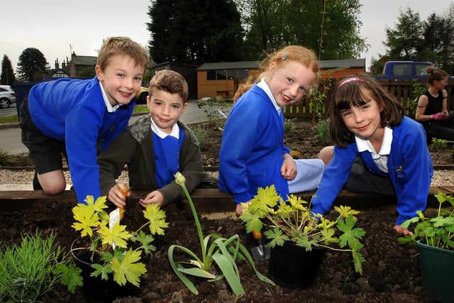 Pupils from Richard Taylor Primary School put the finishing touches to their new garden in 2009 - Morgan Davis, Tyler Smith, Lizzie Cardwell and Kirsty MacGregor
