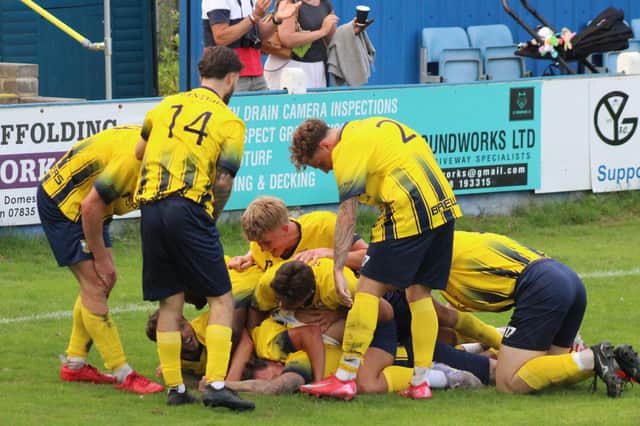 Tadcaster Albion's players celebrate after Spencer Harris' late goal earned them a dramatic late victory over Beverley Town. Pictures: Keith Handley