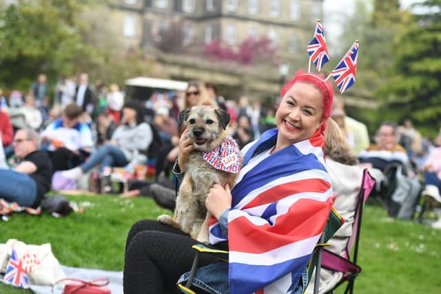 Pictured in red white and blue Claire Blenkinsop and her dog Lily at the coronation celebrations in Valley Gardens, Harrogate. (Picture Gerard Binks)