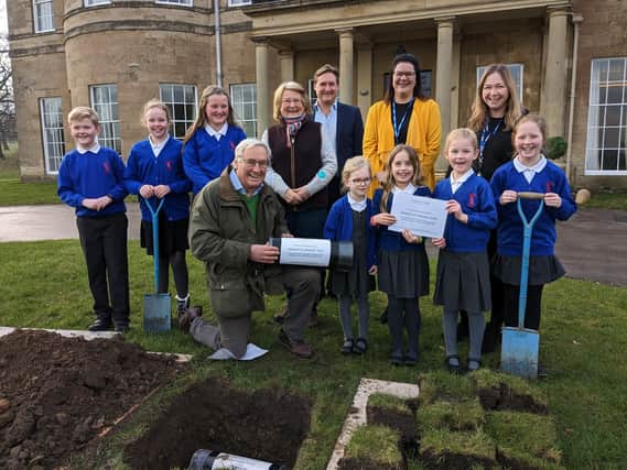 50th anniversary time capsule ceremony  2023 - Simon Mackaness, owner of Rudding Park in Harrogate, with  Follifoot C of E Primary  School  pupils William, Imogen, Alex, Florence, Olive, Florence and Beatrice.