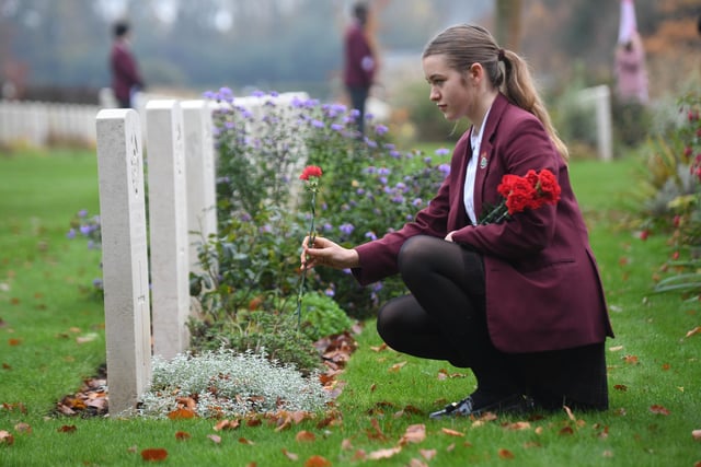 Libby Downey lays red carnations at the Commonwealth War Graves Cemetery at the Rotary Club of Harrogate Brigantes Service of Remembrance