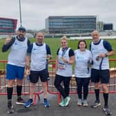 Harrogate fire and ambulance crew members pictured after successfully completing the Manchester Marathon and fundraising for Mind in Harrogate District.