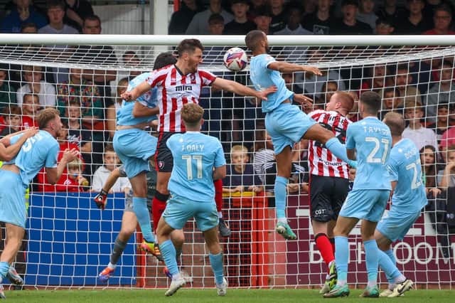 Tom Bradbury heads home the winning goal during Cheltenham's 1-0 home victory over Harrogate Town in September 2024. Picture: Matt Kirkham