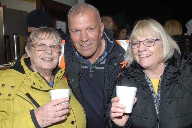 Mick Edwards, Val Storey and Carol Walsh enjoying a hot drink at the Starbeck Bonfire in 2018