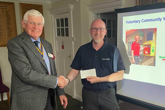Expert help on defibrillators - Matti Ward, right, receiving a cheque for his work from Knaresborough Rotary President Jim Moorhouse. (Picture Knaresborough Rotary)