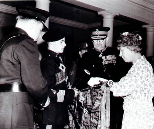 This photo was taken in 1961, when Bob was a Junior Pipe Major and presented to Royalty. Pictured left to right are: Lt Col LHM Gregory, Bob Etherton with his pipes, Major General L de M Thullier and the then Princess Royal.