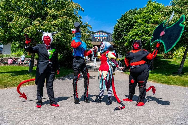 Cosplay characters (left to right) Tia Holland, as Moxxie, Aziraphale George, as Asmodeus, Finney Kennedy, as Fizzarolli, and Lauren De Laloe, as Millie.