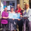 Isabel Ball (right) from St Michael’s Hospice receives a cheque from (left to right) Toni Cooper (Partou Woodlands Harrogate), Bambi Wainright (Partou Little Dragons) and Vicky Gildea (Partou Safehands)