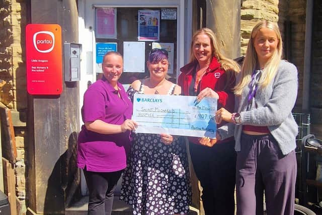 Isabel Ball (right) from St Michael’s Hospice receives a cheque from (left to right) Toni Cooper (Partou Woodlands Harrogate), Bambi Wainright (Partou Little Dragons) and Vicky Gildea (Partou Safehands)
