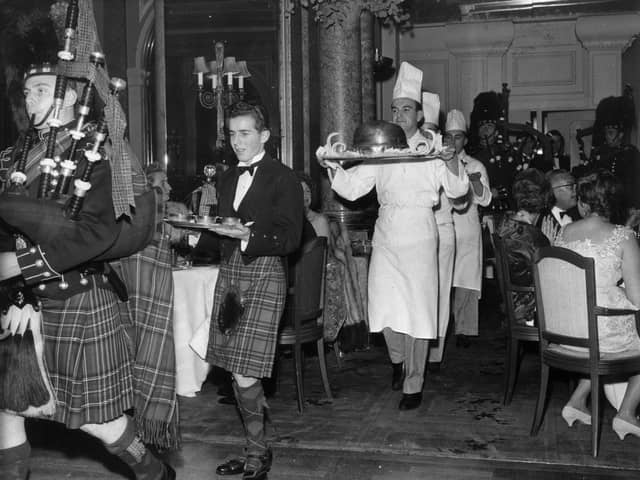 1st December 1959:  Piping in the haggis in the restaurant at the Savoy Hotel, London.The haggis born by a chef is preceded by a piper and the whisky.  It is usually eaten on Burns night (25th January).  (Photo by Evening Standard/Getty Images)