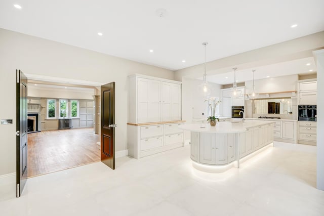 The hallway leads through in to the open plan kitchen.