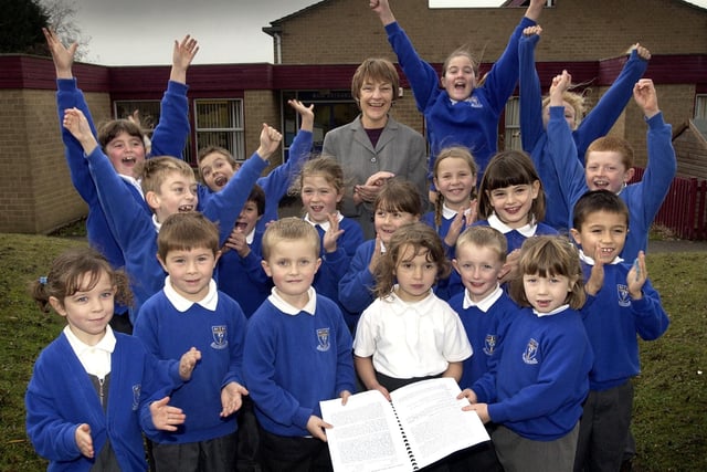 Children from Richard Taylor Primary School with Headteacher Barbara Belsham celebrating their Ofsted report in 2003