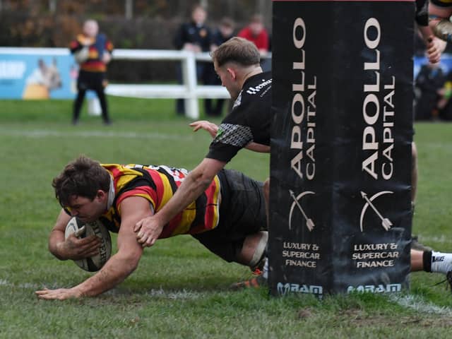 Will Hill dives over the try-line during Harrogate RUFC's comprehensive home success over local rivals Otley. Pictures: Gerard Binks