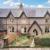The attractive exterior of the listed cottage that is for sale at £299,950.