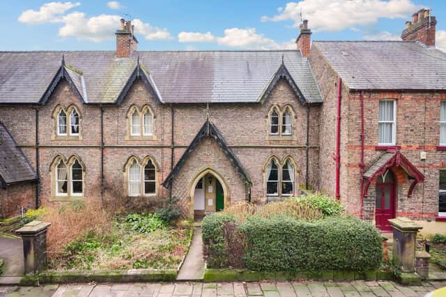 The attractive exterior of the listed cottage that is for sale at £299,950.