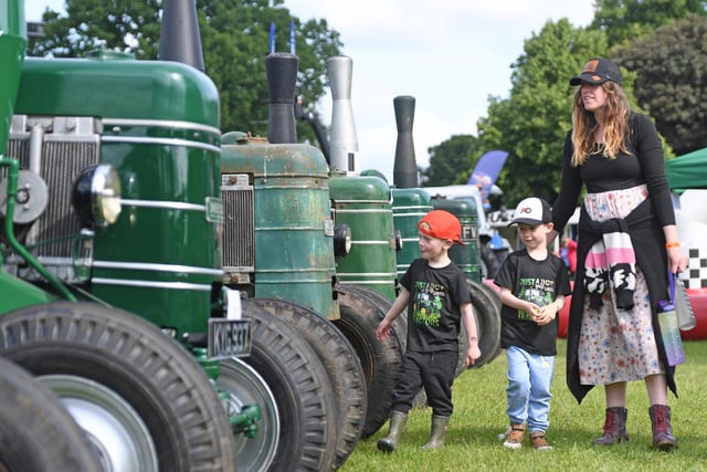 Visitors of all ages enjoying the tractors on display at the festival
