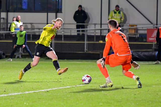 Luke Armstrong slots home his second goal of the game during Harrogate Town's 3-2 League Two success over Grimsby Town. Picture: Ben Roberts/ProSportsImages