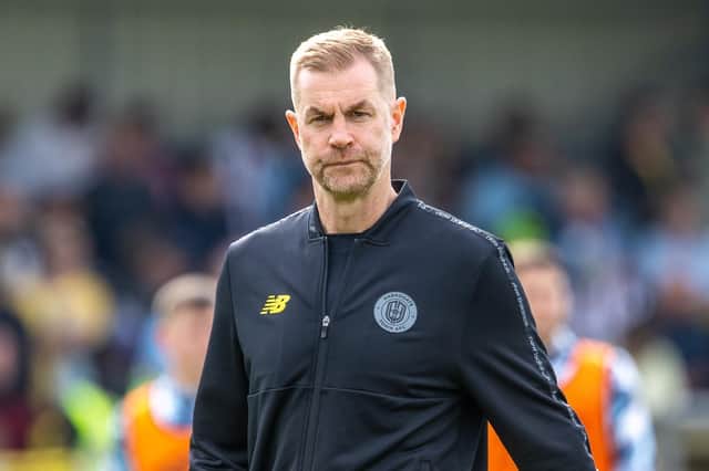 Harrogate Town manager Simon Weaver was far from happy as he headed into the home changing room during the half-time interval of Saturday's League Two clash with Grimsby. Pictures: Jez Tighe/ProSportsImages