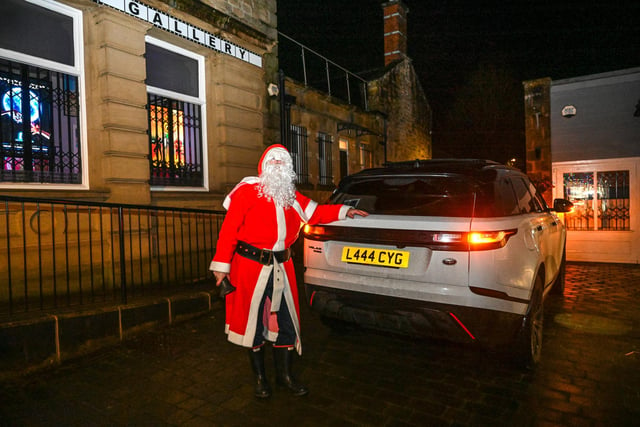 There was no mistaking Santa himself as he was chauffeured in his white Range Rover.