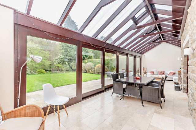 Versatile indoor space that opens to a patio and gardens - ideal for the summer.