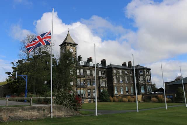 The union jack flag at Ashville College flying at halfmast in memory of Her Majesty the Queen