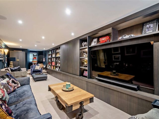 Versatile space used currently as a media and sitting room.