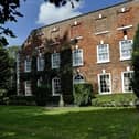 The previous look of the exterior included moss covering the brick building.