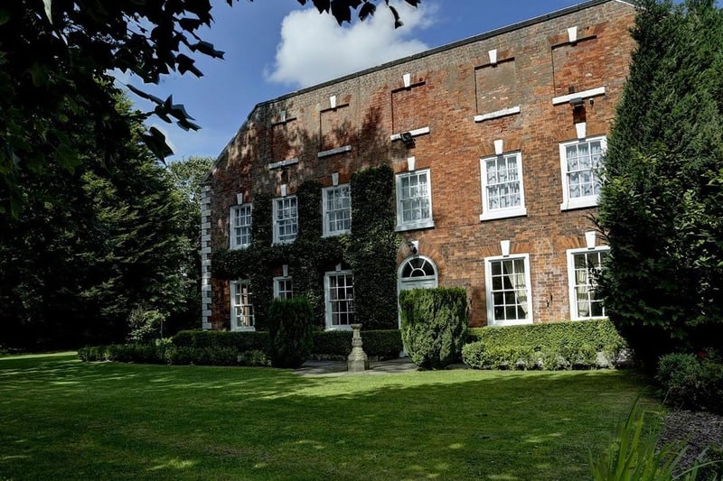 The previous look of the exterior included moss covering the brick building.