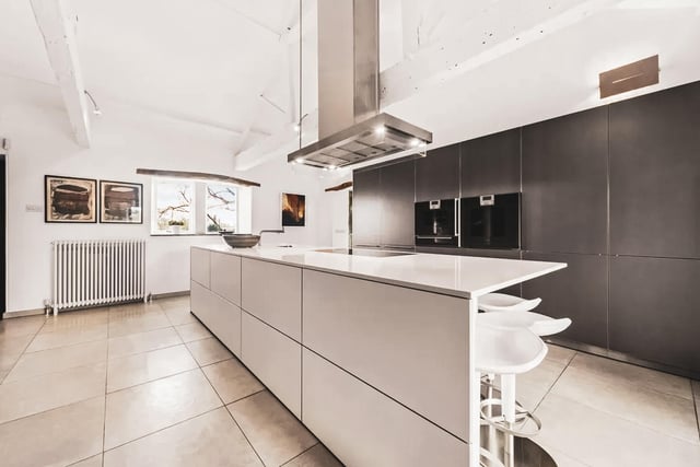 The kitchen is designed by Bulthaup, with bespoke features throughout.