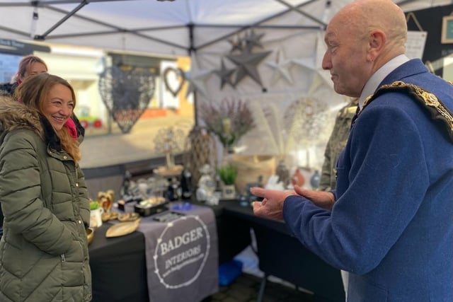 Pictured: Major of Ripon City Sid Hawke shaking hands with the founders at Badger Designs.