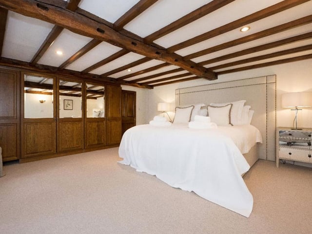 Another light and airy bedroom with cosy period features to accommodate large families.