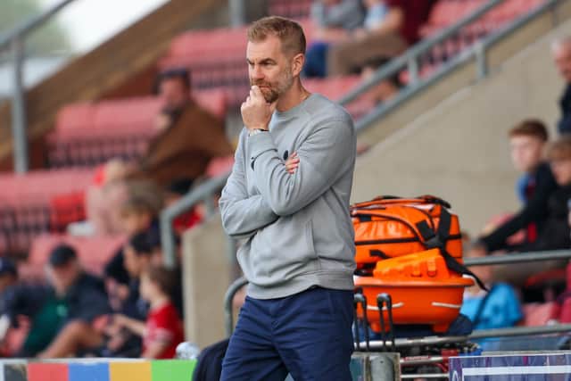 Harrogate Town manager Simon Weaver watches on at Gresty Road.